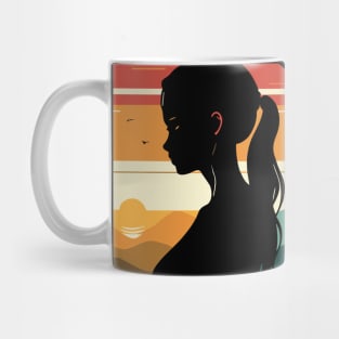 A T-shirt featuring a silhouette of a girl and stunning colors inspired by the sunset. Mug